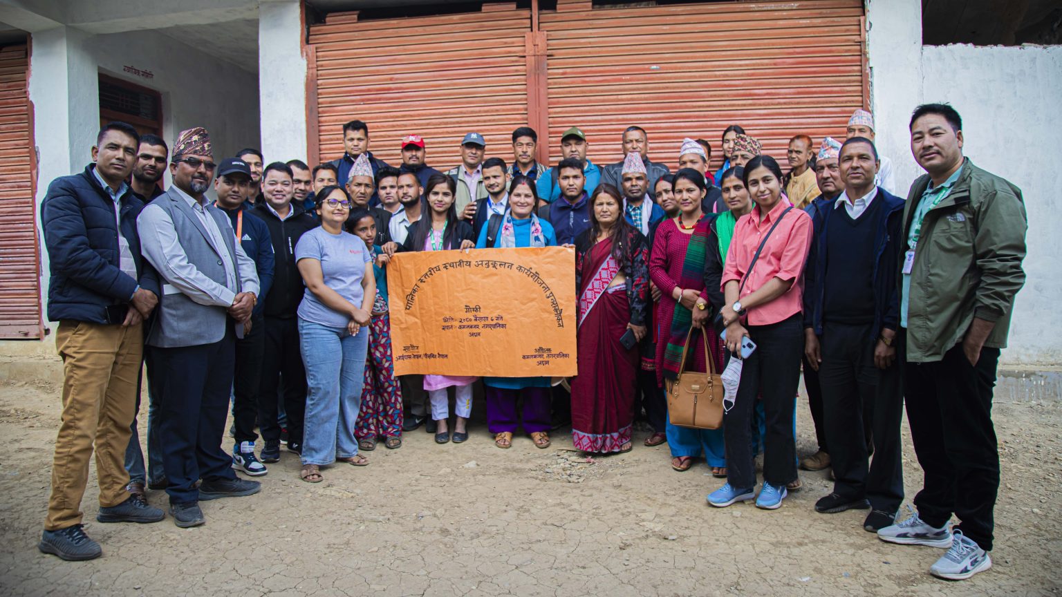 Four women holding sheets of paper